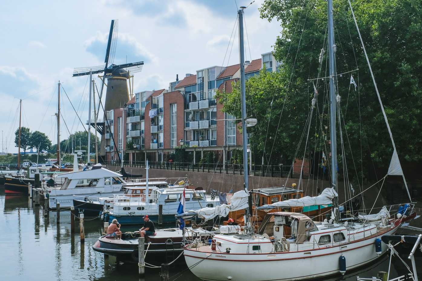 Boats in Rotterdam, near a windmill